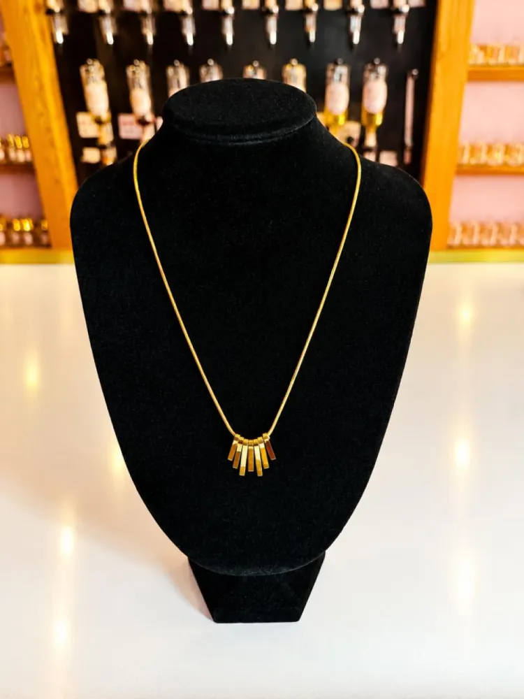 Collier doré barres géométriques
