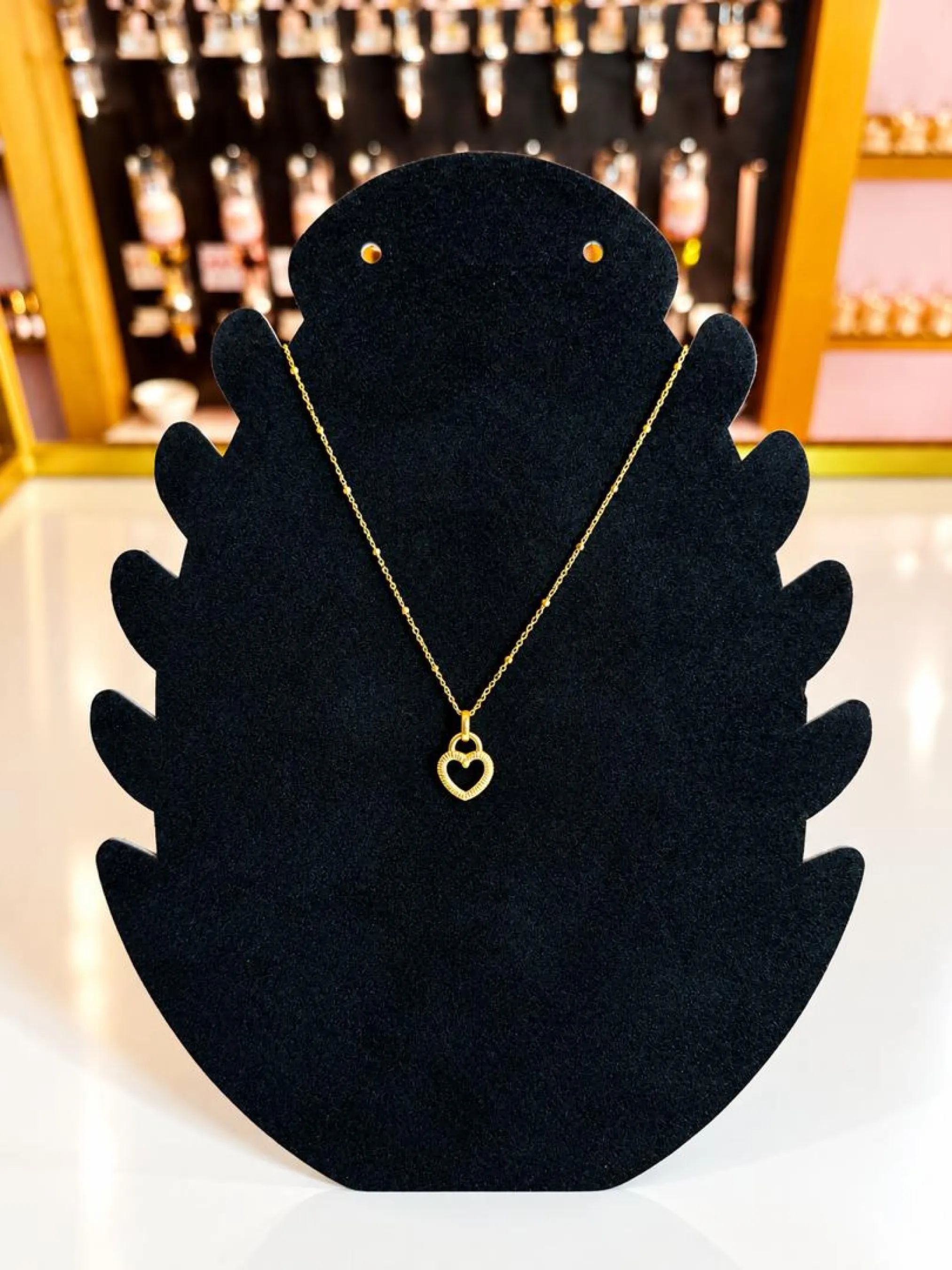 Collier doré coeur double ajouré