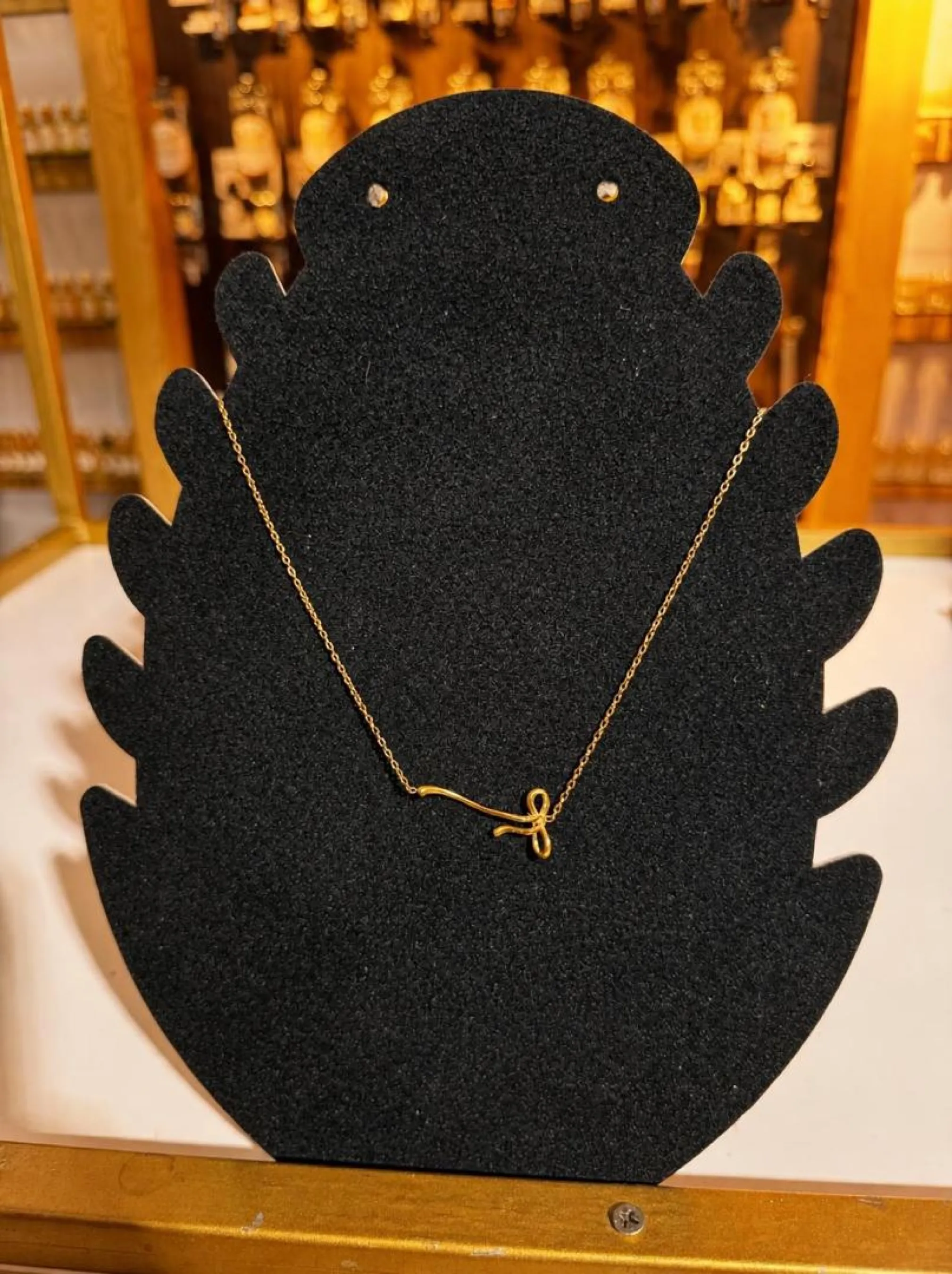 Collier noeud asymétrique doré